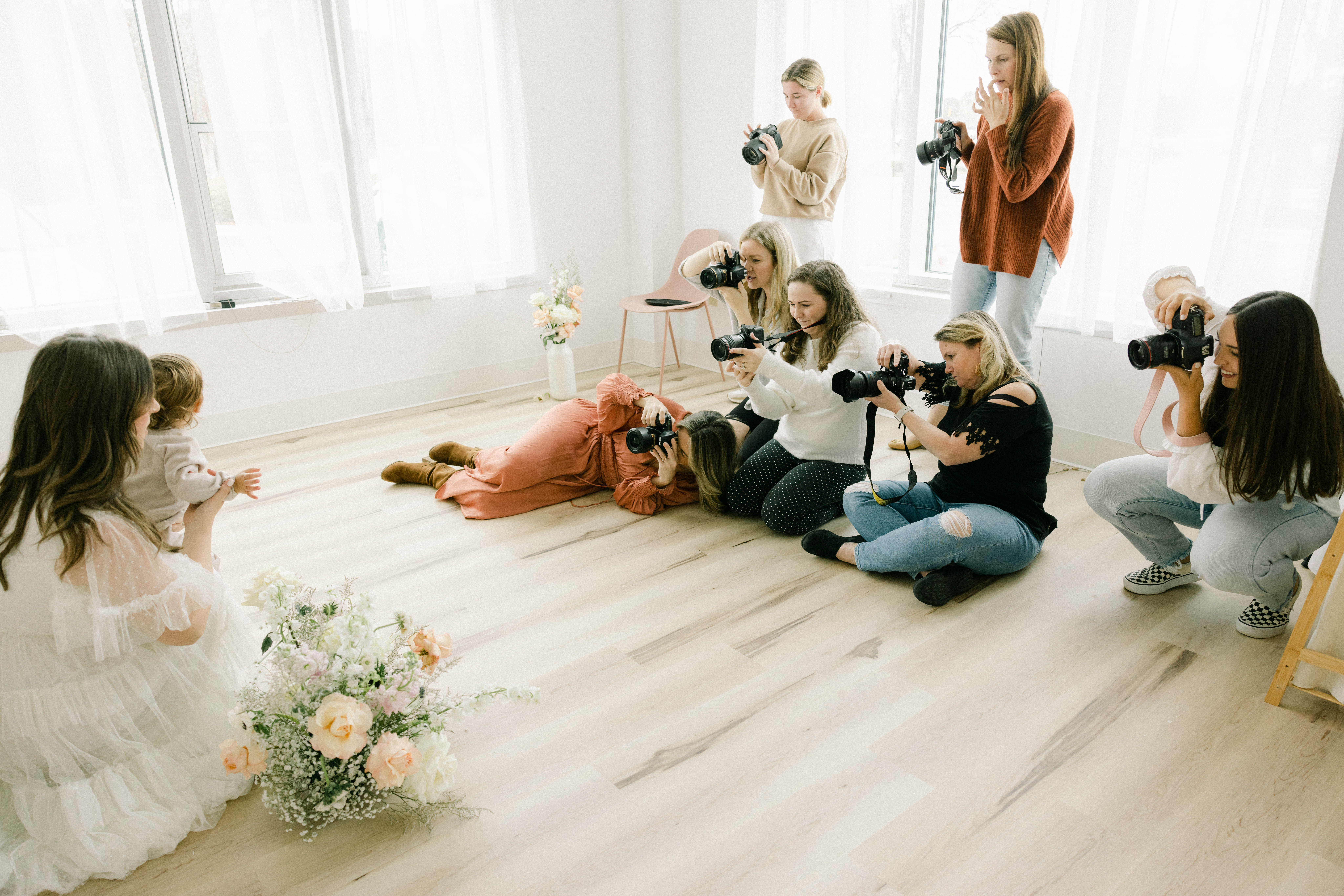 CAP elevate coworking women taking photos with cameras